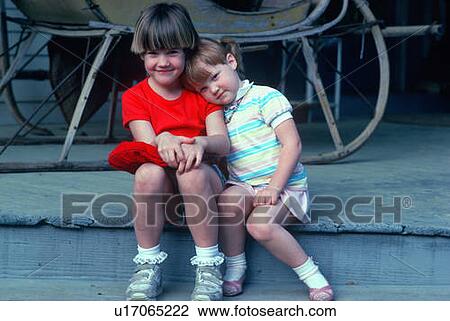 Two adorable little girls View Large Photo Image Stock Image - Two adorable little girls. Fotosearch