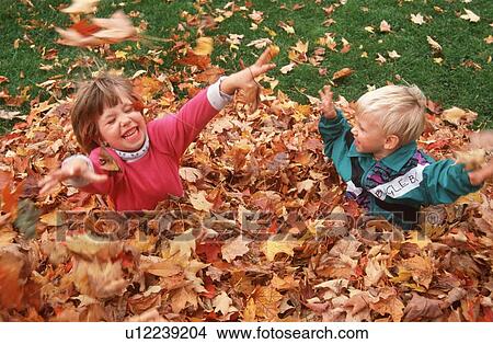 Image result for children playing autumn leaves