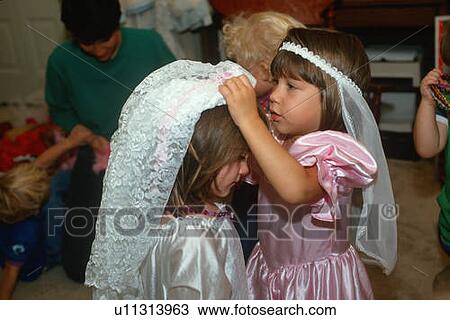 Two little girls playing dress up at their pre-school View Large Photo Image Stock Image - Two little girls playing dress up at their pre-school. Fotosearch