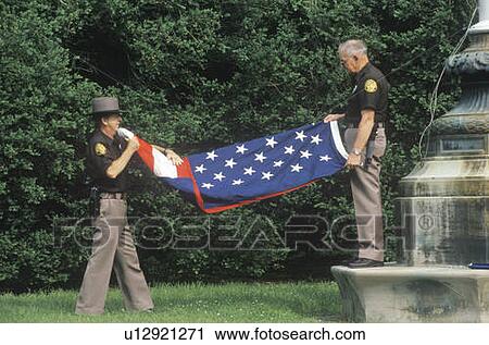 Two Officers Folding the American Flag View Large Photo Image Stock Image - Two Officers Folding the American Flag. Fotosearch