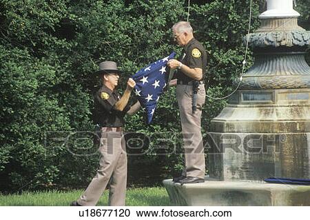 Two Officers Folding the American Flag View Large Photo Image Stock Image - Two Officers Folding the American Flag. Fotosearch
