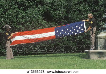 Two Officers Folding the American Flag View Large Photo Image Stock Photo - Two Officers Folding the American Flag. Fotosearch