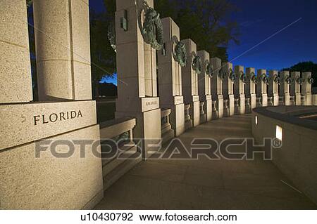 Stock Image - U. S. World War II Memorial commemorating World War II in Washington D. C. at dusk. Fotosearch