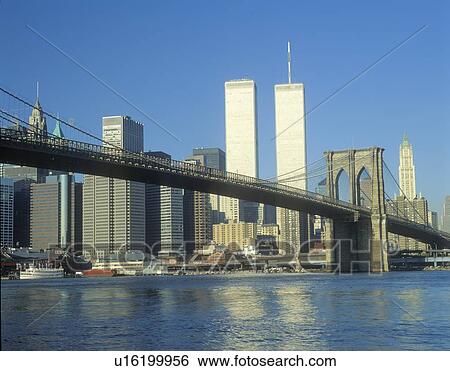 Stock Photograph - View from East River of the Brooklyn Bridge and skyline in New York City, New York. Fotosearch