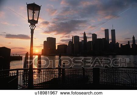 Stock Photo - View of Manhattan from the Brooklyn Bridge at sunset, New York City, New York. Fotosearch