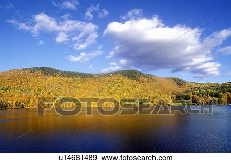 View of Woodstock, VT on lake in autumn View Large Photo Image Stock Photo - View of Woodstock, VT on lake in autumn. Fotosearch
