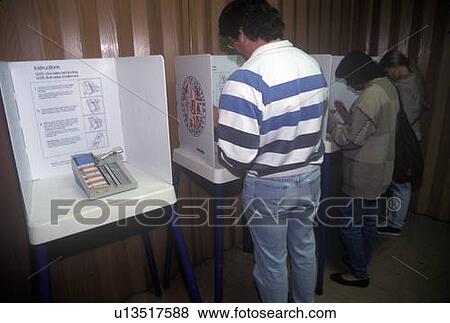 Stock Photo - Voters and voting booths in a polling place. Fotosearch