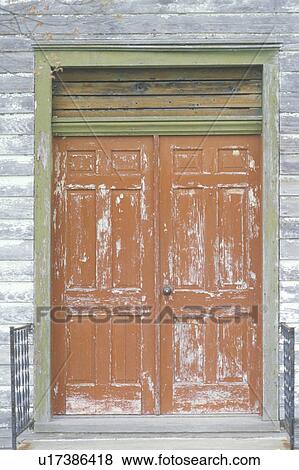 Stock Photo - Weather beaten wooden doors. Fotosearch