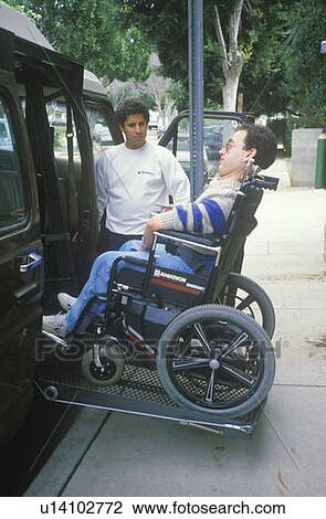 Wheelchair bound young man getting into specially equipped van View Large Photo Image Stock Image - Wheelchair bound young man getting into specially equipped van. Fotosearch