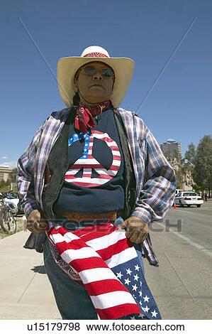 Stock Photo - Woman with a Peace-American t-shirt at a political rally. Fotosearch