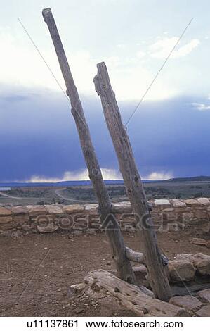 Stock Image - Wooden ladder leading to mud roof. Fotosearch