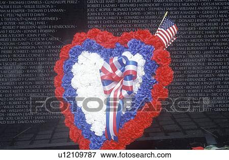 Stock Photo - Wreath and Flag in front of Vietnam Wall Memorial, Washington, D. C.. Fotosearch