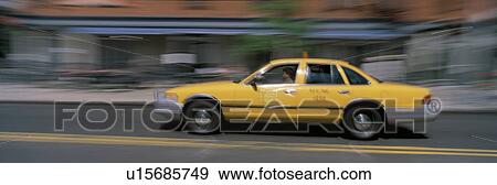 Stock Photo - Yellow Taxi in Motion. Fotosearch