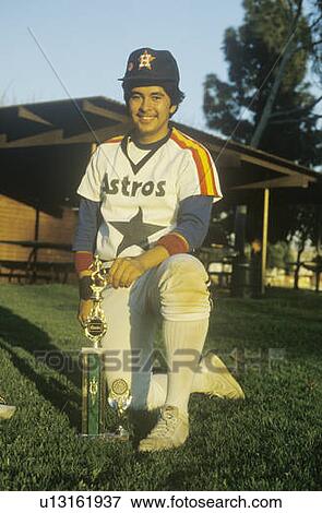 Young Hispanic Baseball player posing with trophy View Large Photo Image Stock Photo - Young Hispanic Baseball player posing with trophy. Fotosearch