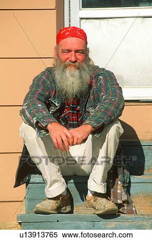 A man sitting on wooden steps View Large Photo Image Stock Photography - A man sitting on wooden steps. Fotosearch