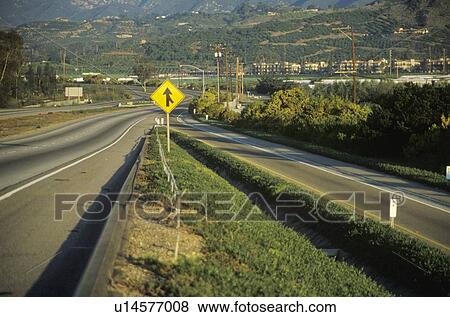 A merge sign on a highway View Large Photo Image Stock Photo - A merge sign on a highway. Fotosearch