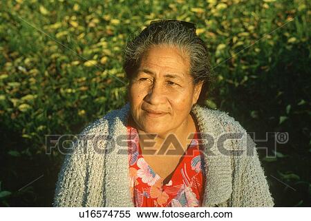 Stock Photography - A Samoan woman smiling with the sun on her face. Fotosearch