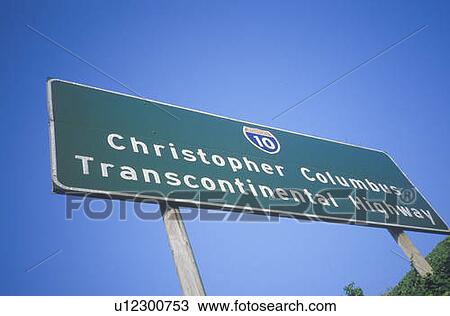 Stock Image - A sign that reads “Christopher Columbus Transcontinental Highway”. Fotosearch