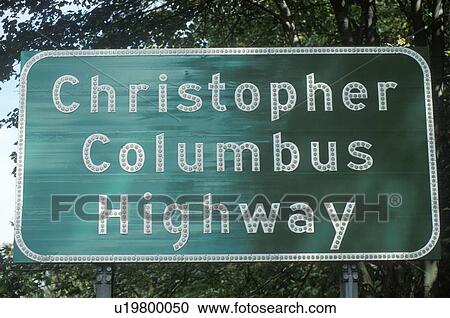 Stock Image - A sign that reads “Christopher Columbus Highway”. Fotosearch