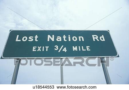 Stock Image - A sign that reads “Lost Nation Rd”. Fotosearch