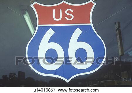 A US route 66 sign hanging in a window View Large Photo Image Stock Photo - A US route 66 sign hanging in a window. Fotosearch