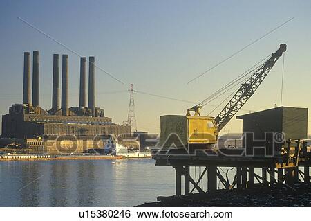 A utility plant and grain barge on the Mississippi River View Large Photo Image Stock Photograph - A utility plant and grain barge on the Mississippi River. Fotosearch