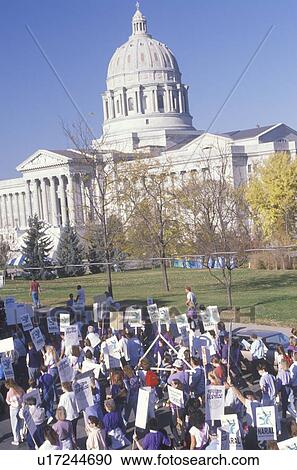 Stock Image - Activists marching at State Capitol Building, Missouri. Fotosearch