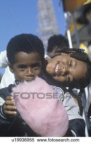 African-American children eating cotton candy View Large Photo Image Stock Photography - African-American children eating cotton candy. Fotosearch