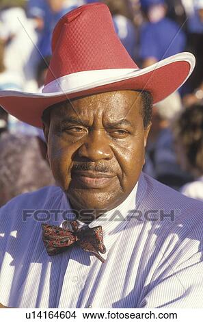 An African-American man at the U. S. Senior Olympics wearing a red cowboy hat View Large Photo Image Picture - An African-American man at the U. S. Senior Olympics wearing a red cowboy hat. Fotosearch