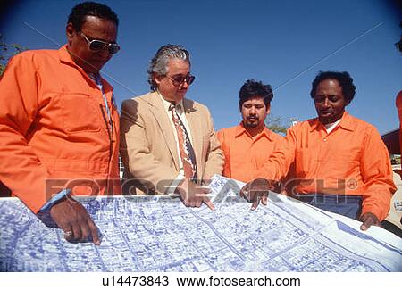 An architect reviewing the building plans with his crew View Large Photo Image Stock Image - An architect reviewing the building plans with his crew. Fotosearch