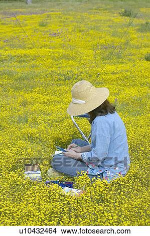 An artist sketching spring flower fields View Large Photo Image Picture - An artist sketching spring flower fields. Fotosearch