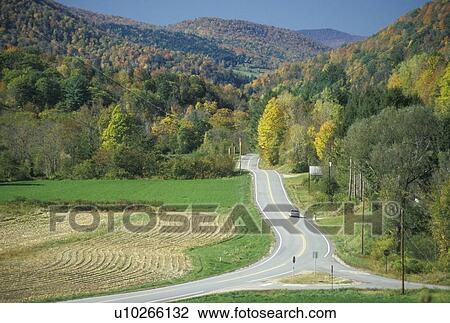 Stock Image - An open road on scenic Route 100 near Stockbridge, Vermont. Fotosearch