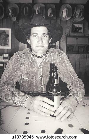 Black and White portrait of cowboy in bar with beer View Large Photo Image Stock Photography - Black and White portrait of cowboy in bar with beer. Fotosearch