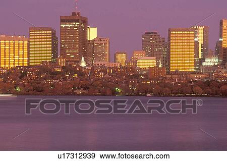 Stock Photo - Boston Massachusetts skyline at sunset from Charles River. Fotosearch
