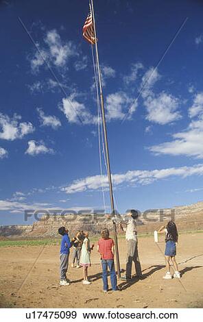 Stock Photo - Children looking at the American flag. Fotosearch