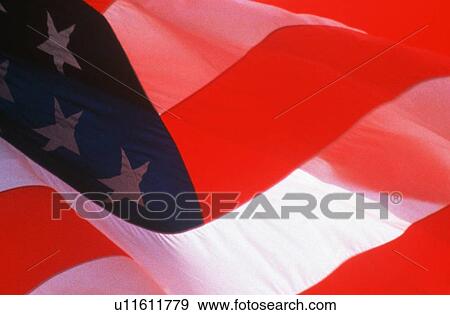 Stock Photo - Close-up of American flag blowing in the wind. Fotosearch