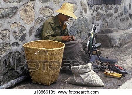 Cobbler in Bei Village in Dali, Yunnan Province, People's Republic of China View Large Photo Image Stock Photography - Cobbler in Bei Village in Dali, Yunnan Province, People's Republic of China. Fotosearch