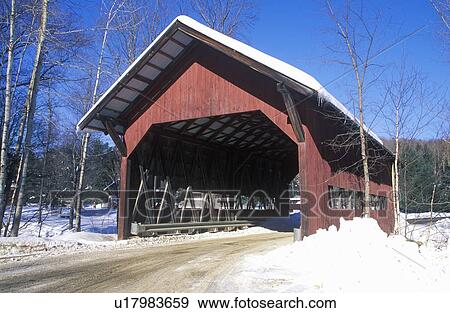 Stock Photo - Covered bridge along Brook Road in Stowe, Vermont during the winter. Fotosearch
