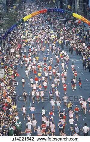 Stock Image - Crowd of runners crossing 1st Avenue/ 59th Street bridge, NY, NY City Marathon. Fotosearch