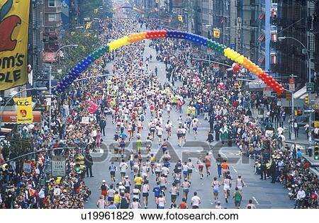Stock Photo - Crowd of runners crossing 1st Avenue/ 59th Street bridge, NY, NY City Marathon. Fotosearch
