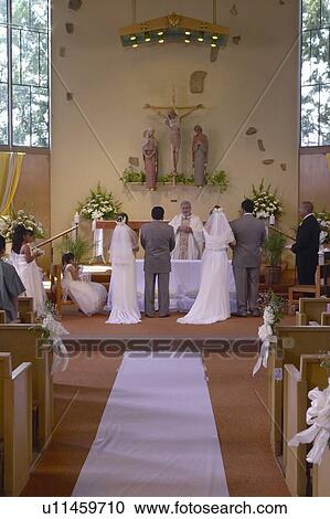 Stock Image - Double Latino-American Catholic wedding. Fotosearch