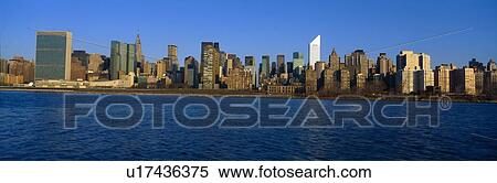 Stock Photography - East River and New York Skyline, View from Queens, New York. Fotosearch