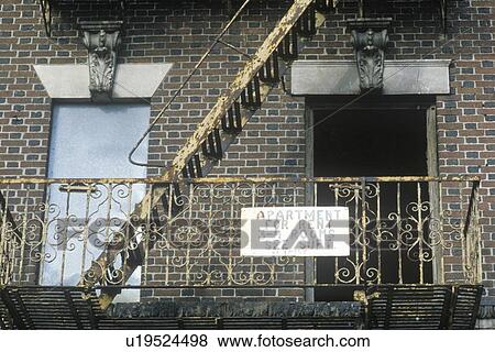 Fire escape and apartment for rent sign View Large Photo Image Stock Photo - Fire escape and apartment for rent sign. Fotosearch