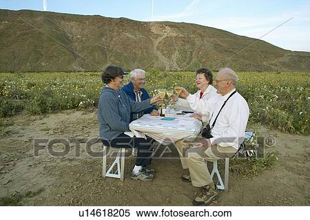 Four senior citizens drinking white wine View Large Photo Image Stock Photography - Four senior citizens drinking white wine. Fotosearch