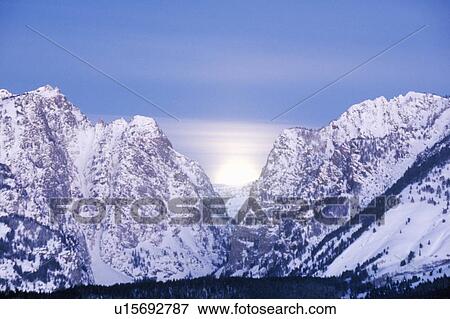 Full Moon Setting Behind The Grand Tetons, Jackson, Wyoming View Large Photo Image Stock Photo - Full Moon Setting Behind The Grand Tetons, Jackson, Wyoming. Fotosearch