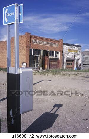 Stock Image - Ghost town with Phone Booth. Fotosearch