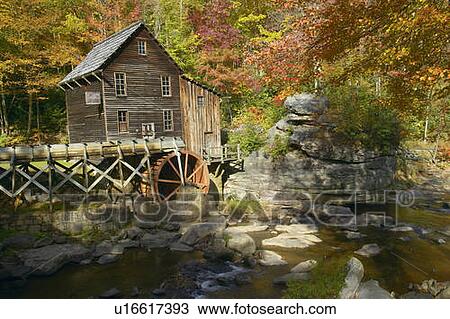 Stock Image - Glade Creek Grist Mil and autumn reflections and water fall in Babcock State Park, WV. Fotosearch
