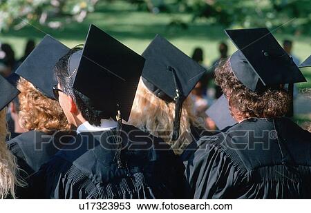 Stock Image - Graduating class walking towards their ceremony. Fotosearch