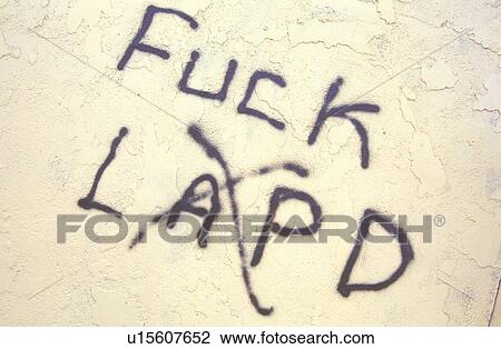 Stock Image - Graffiti with profanity towards Police Department. Fotosearch
