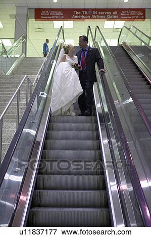 Groom and Bride in airport View Large Photo Image Stock Photo - Groom and Bride in airport. Fotosearch